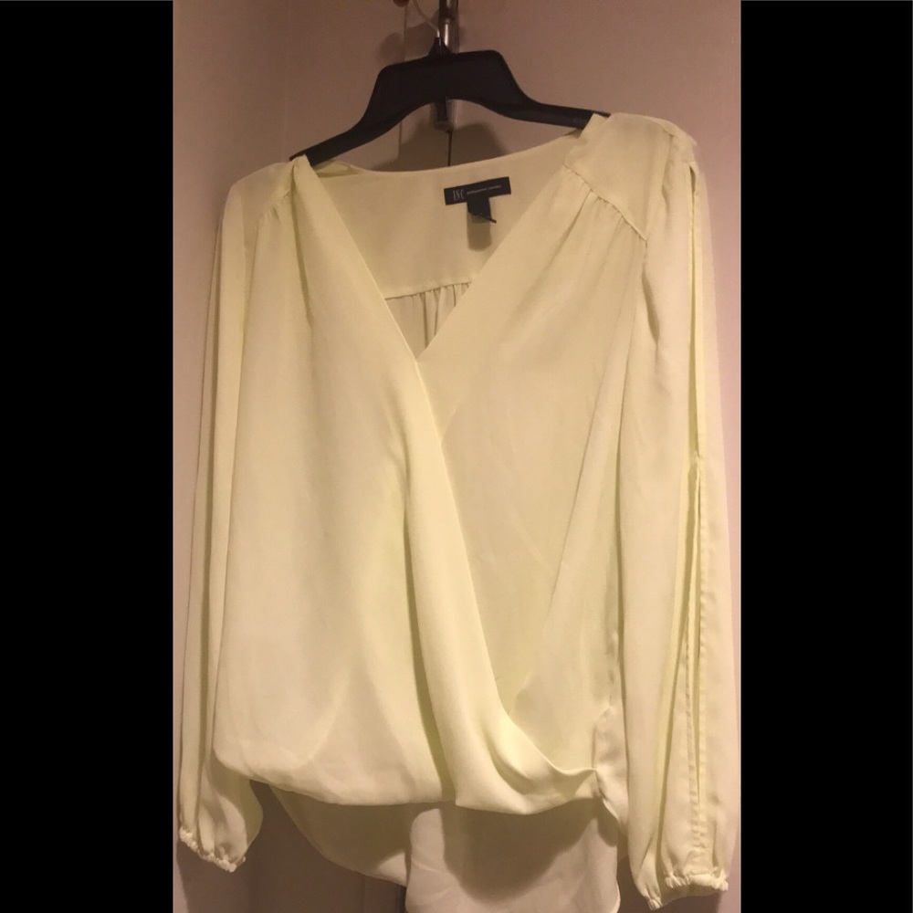 Light yellow long sleeve blouse.